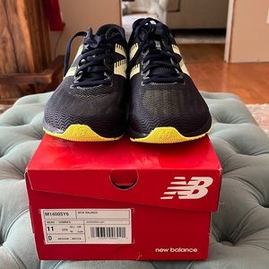 Blue and neon yellow RC1400 New Balance running shoes. Size 11.